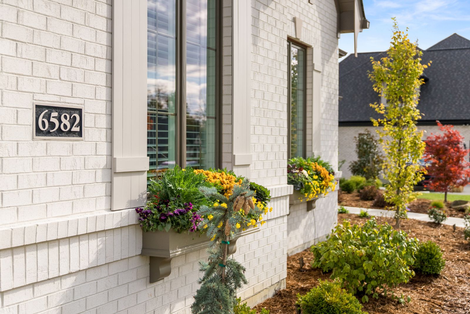 white brick home