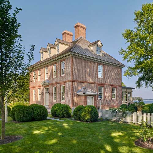 Wide view of two story brick house