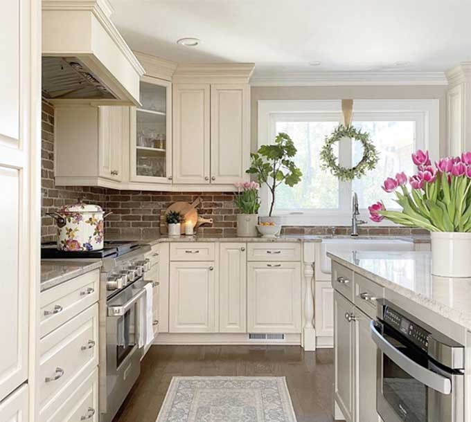 white kitchen with thin brick basksplash