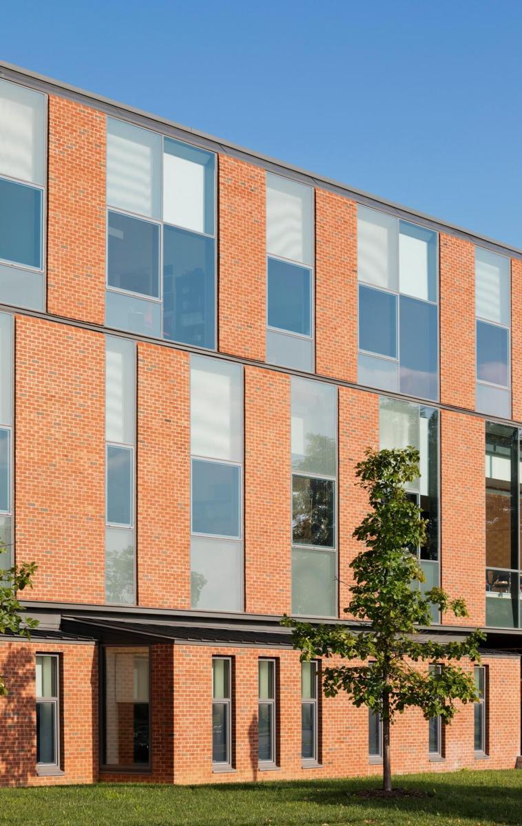 Image of a brown bricked and windowed wall at a Veterinary Center at Ohio State University