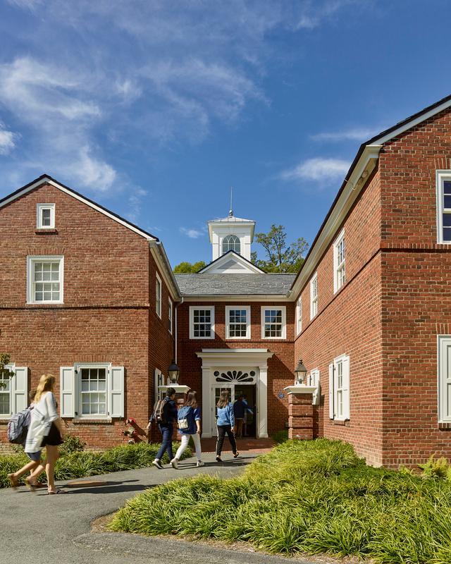 Image of the vibrantly green lawn at the red bricked Millbrook School Dining Hall