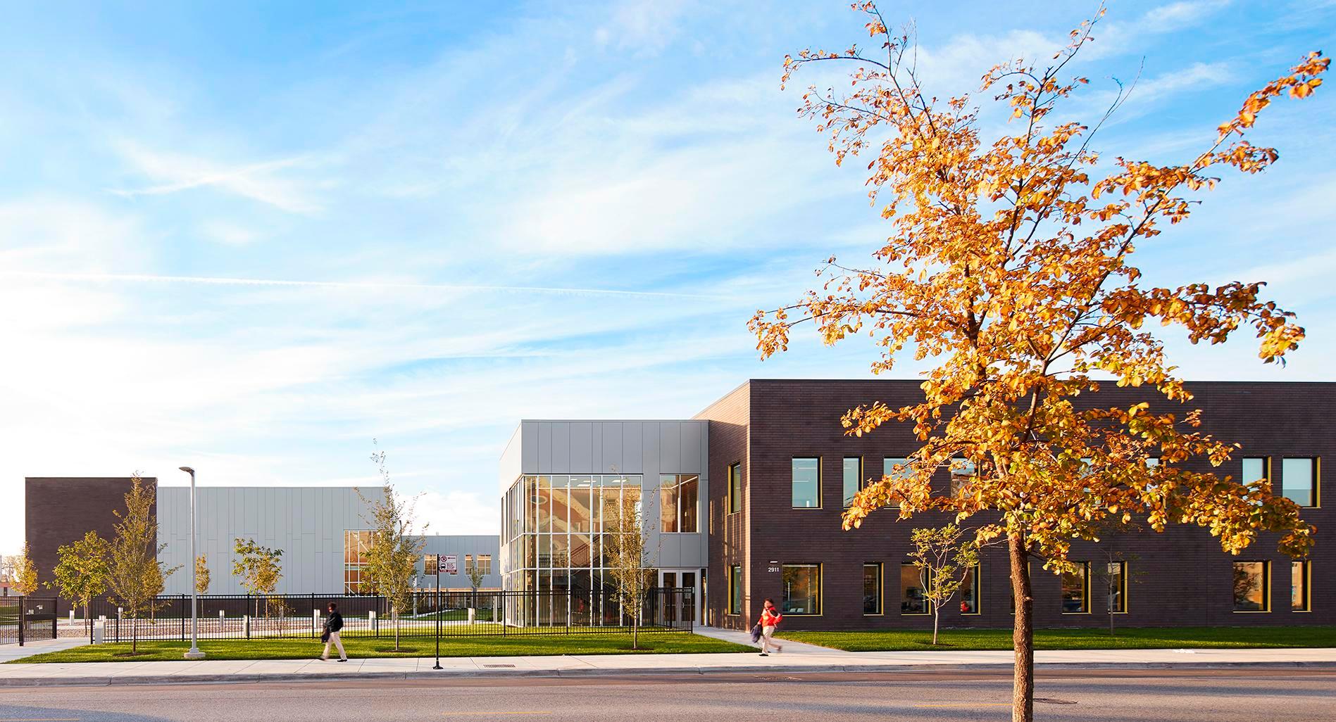 Image of the Mansueto High School, a red bricked building