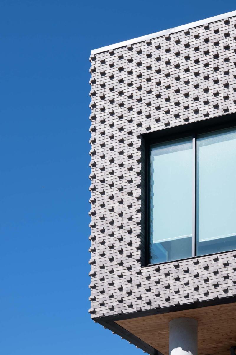 Image of the textured brick exterior of the St. Vincent Mixed Use Building