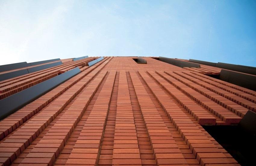 Image of the red textured brick exterior of McCord Hall at Arizona State University