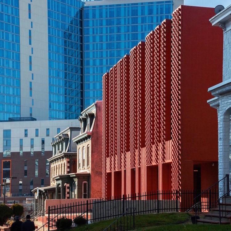 Image of the textured red brick exterior of the windowed Drexel University - The Center for Jewish Life