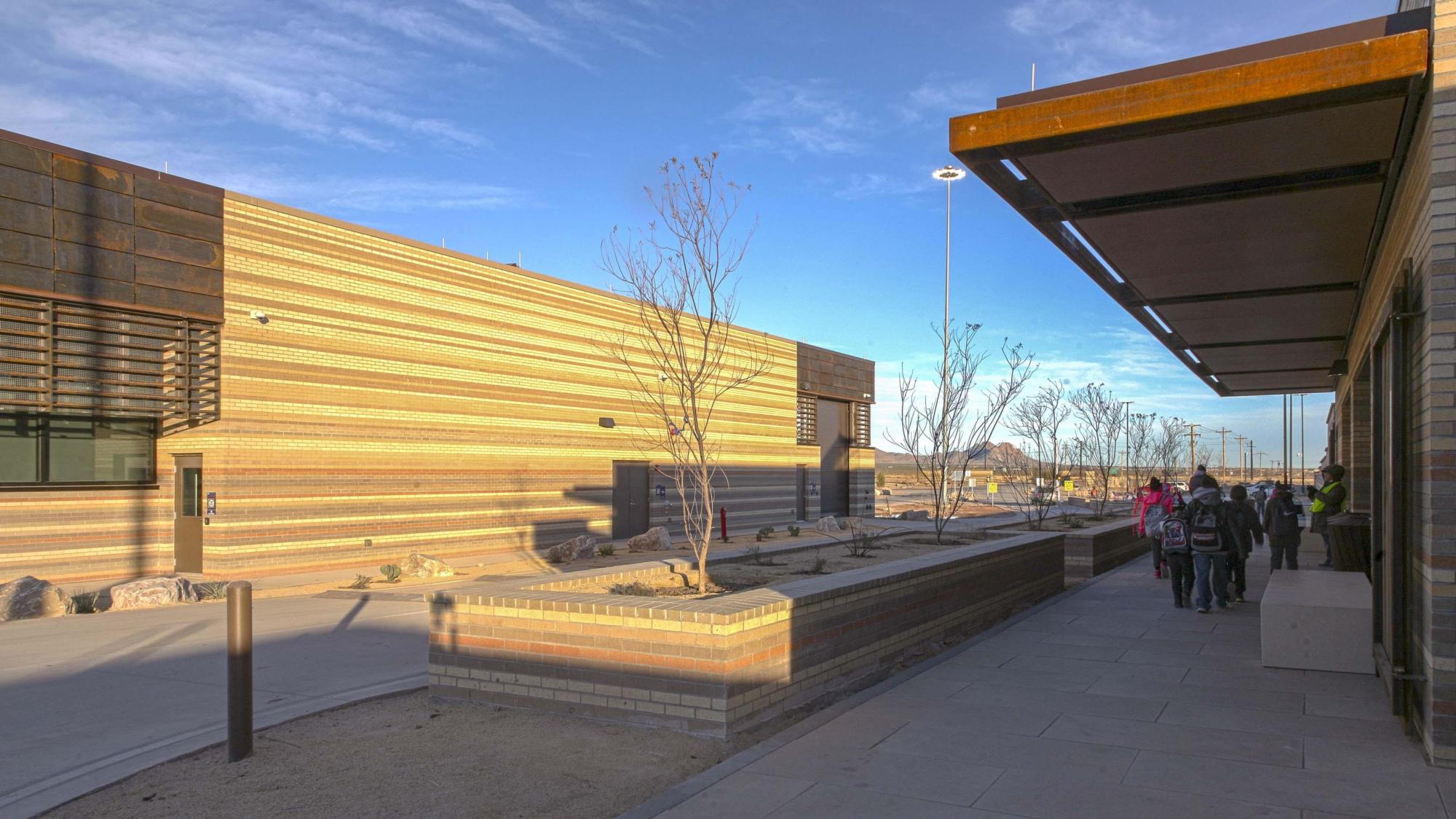Image of the outside of the brown and beige bricked United States Land Port of Entry
