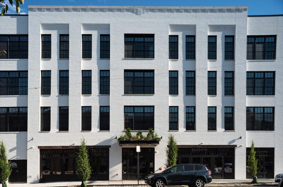 Image of the white bricked 1720 Fairmount Avenue building