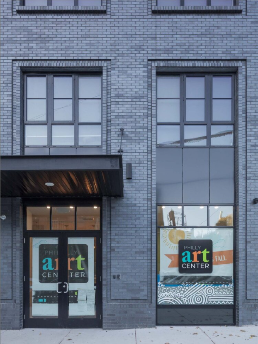 Image of the front of the gray bricked 2333 Fairmount Avenue building