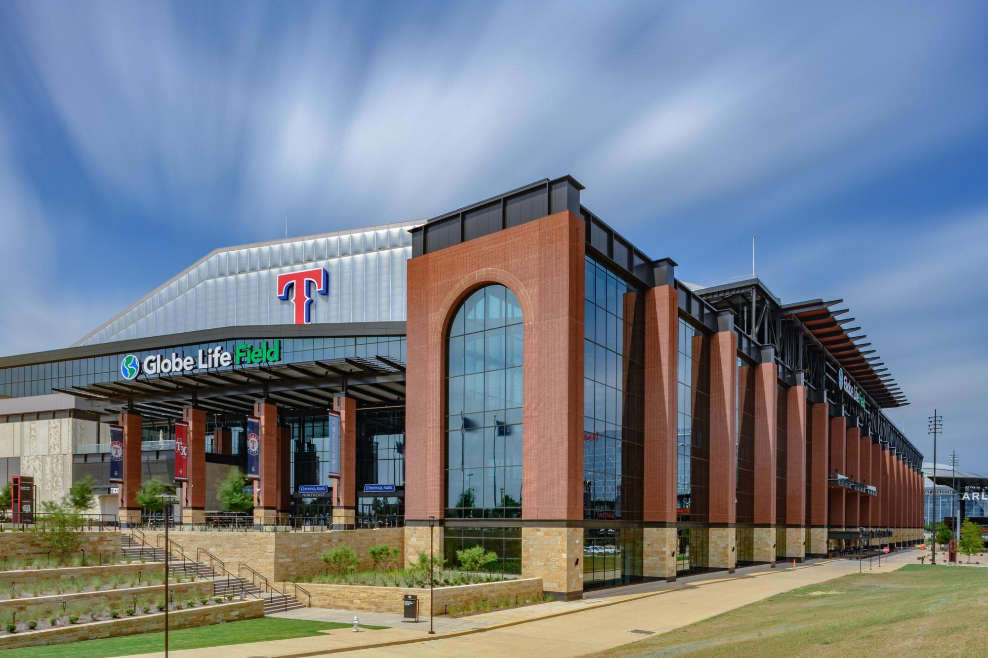 Image of the red bricked, archway adorned Globe Life Field building