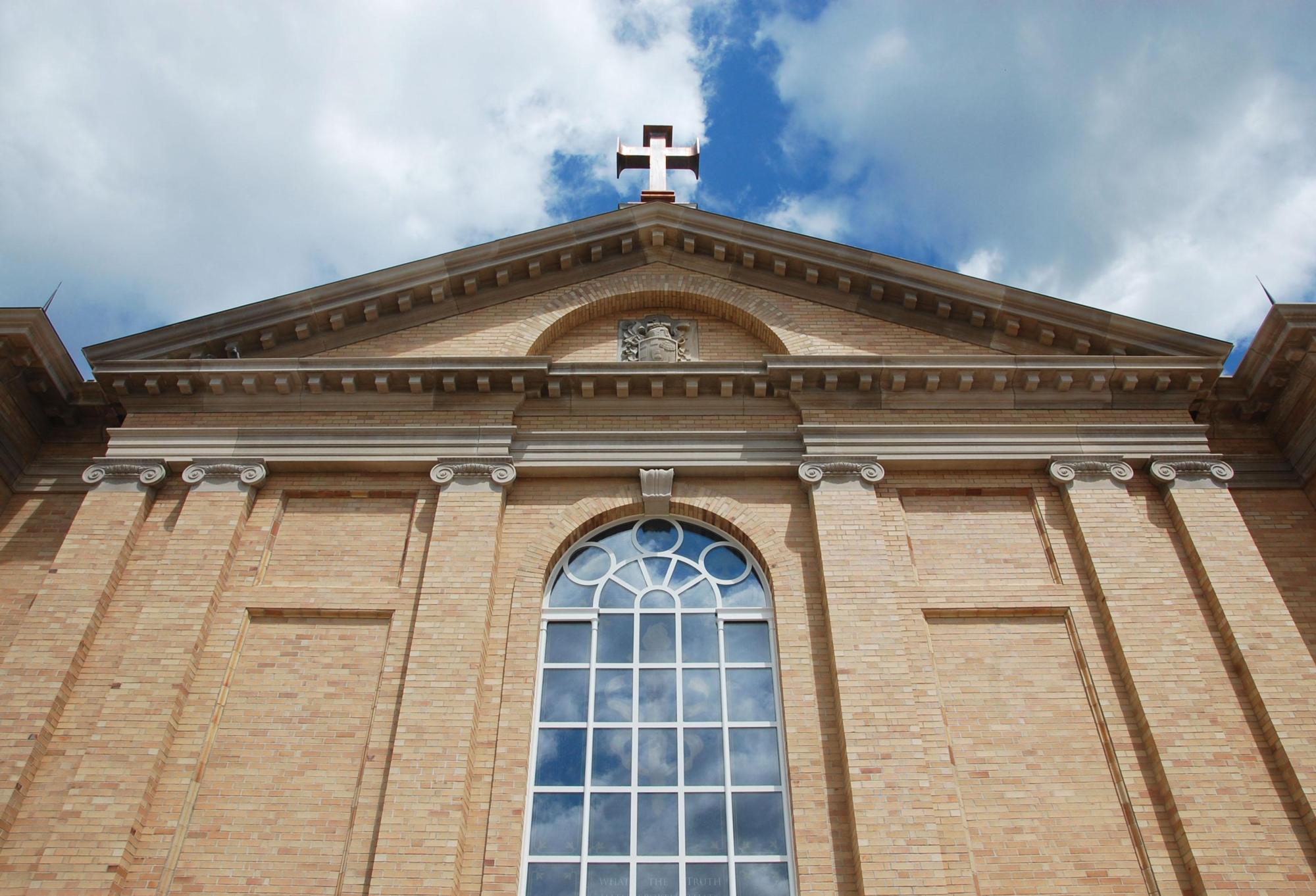 Windowed and finished with a cross of the Christian religion at the apex of the roof stands Hillsdale Christ Chapel