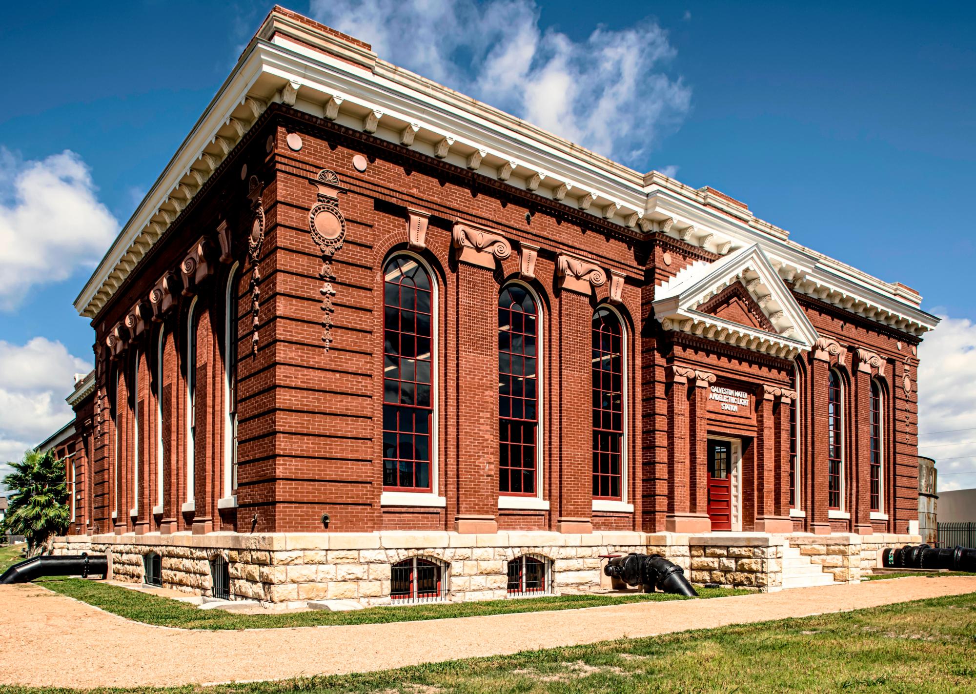 Red brick lines the windowed walls of the City of Galveston 30th St Water and Electric Light Station