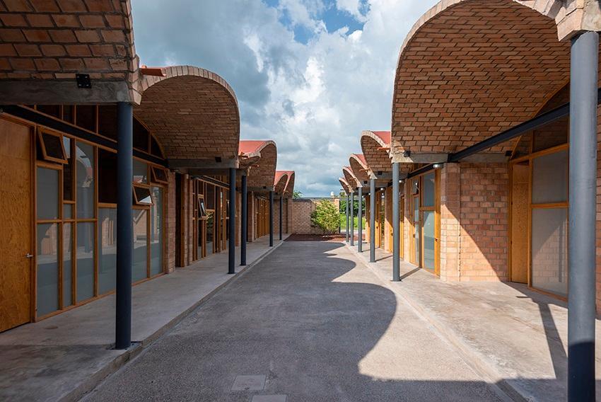 The brick walls and brick paved walkways of the Ruiz Community Center