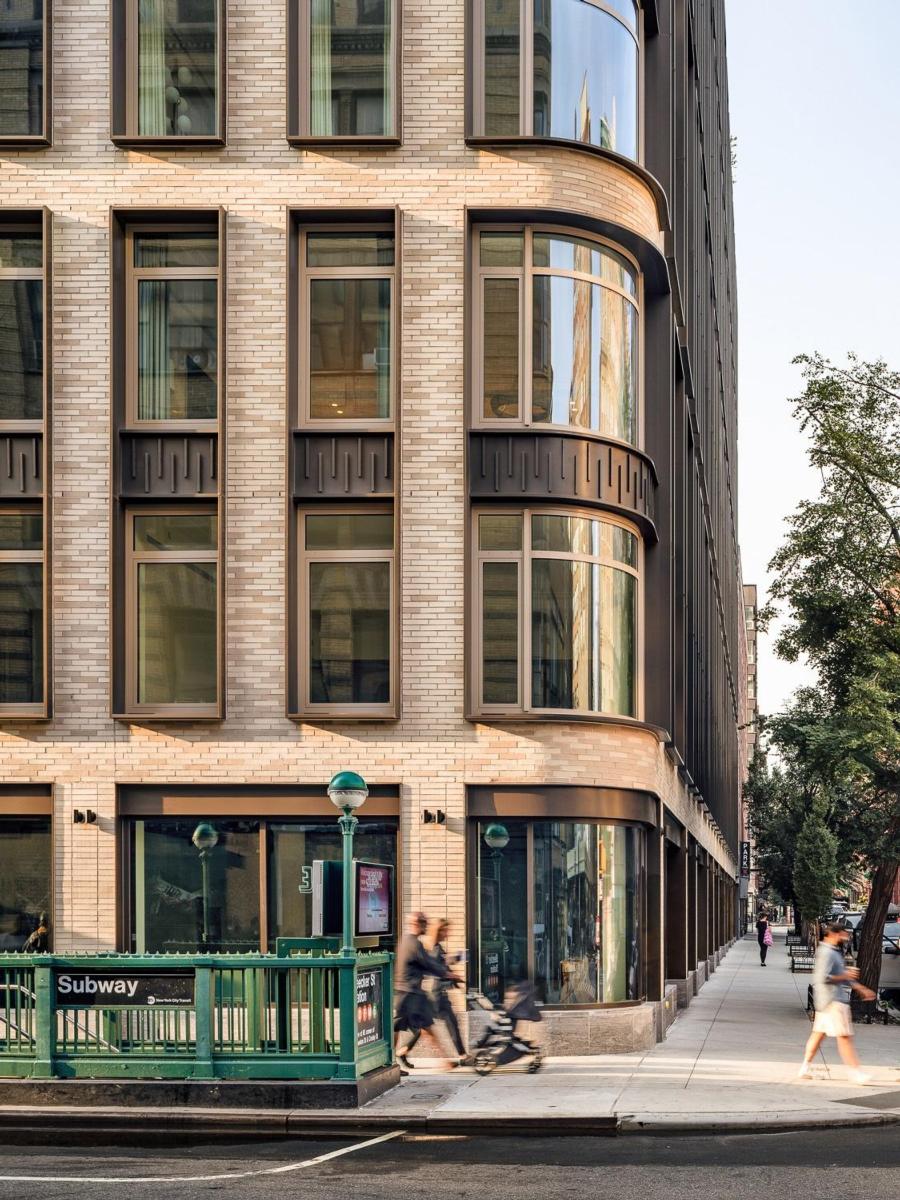 The bricked exterior of the 40 Bleecker Street multi-family housing complex