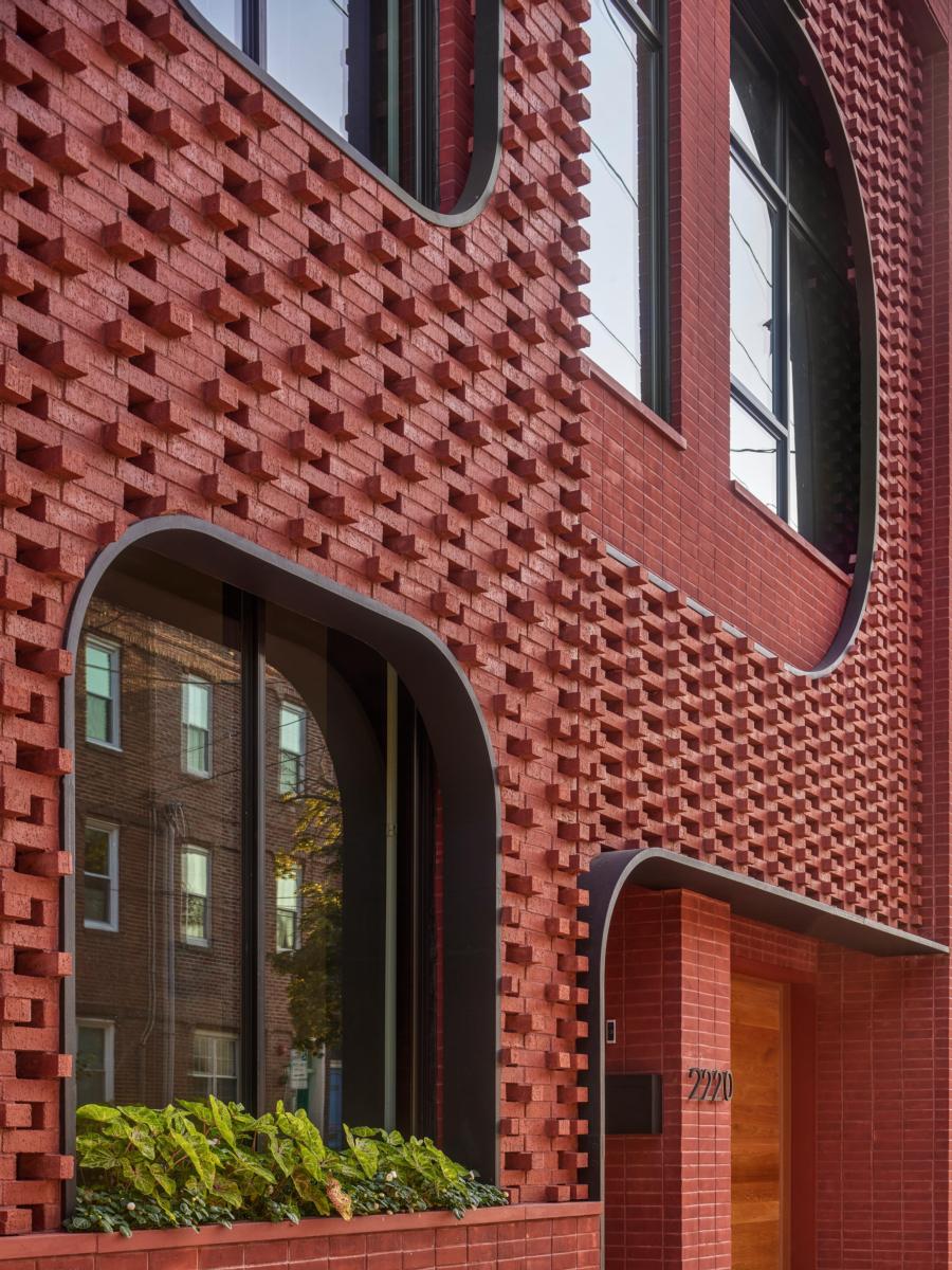 Intricate, classical red brick encases the Filigree House, built with modern styling and flourishing patterns
