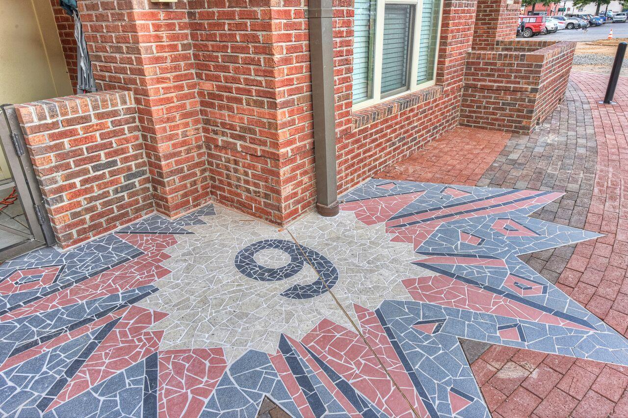 The walkway known as Freedom Walkway is fully adorned in brick, from reds to browns to grays