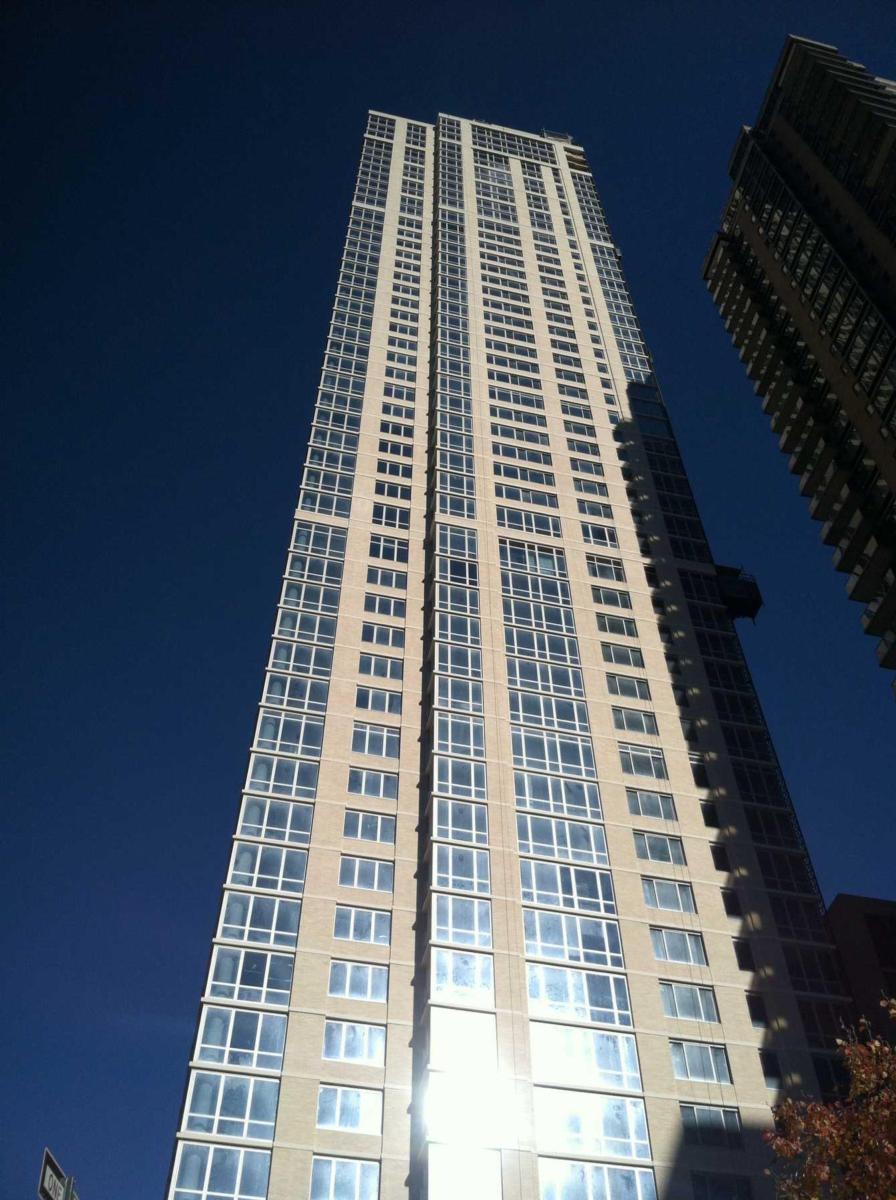 A photo of the residential towers building, accentuating height and the multiple stories of the building