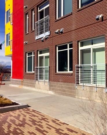 Brick paving, sidewalk, and brick building at 1000 South Broadway