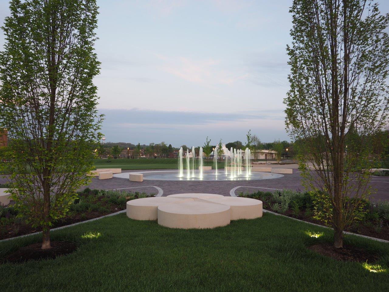 Image of trees, shrubbery and brick paving at Marcum Park