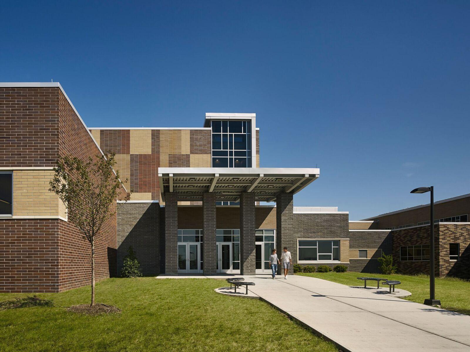 Image of the bricked exterior and green lawn of Phillipsburg High School