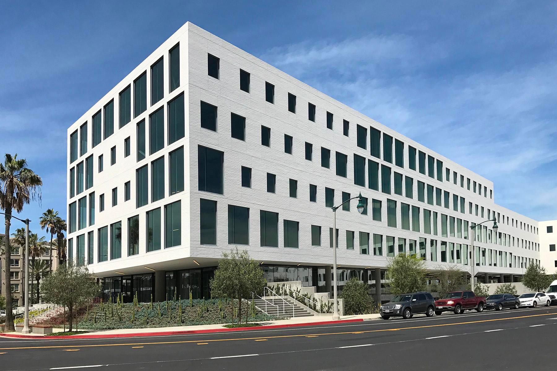 Image of a white bricked building called the brickyard