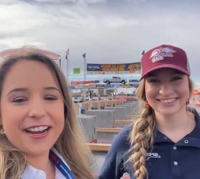 Two women conversing at World of Concrete Expo