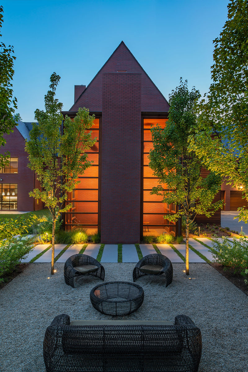 Exterior of home built with brick at dusk